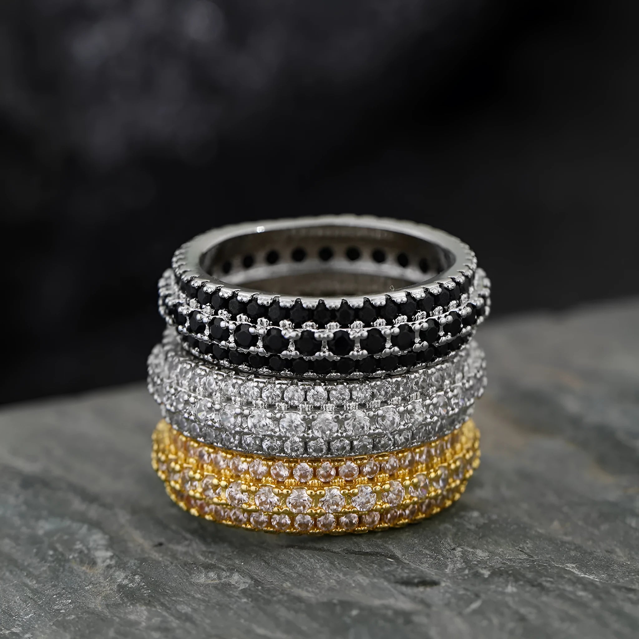 Geometric copper ring with triangular zircon inlay, shown in white gold plating.