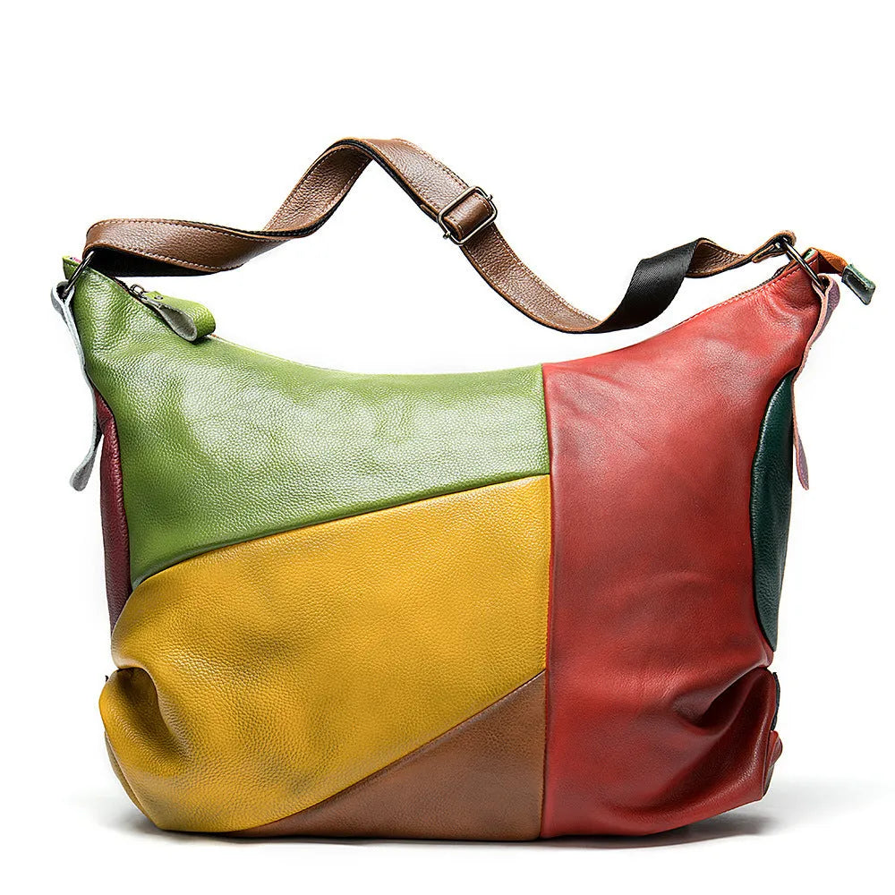 Cowhide leather crossbody travel bag in picture colour, shown with shoulder strap