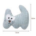 Cyan knitted plush cat toy with bell and catnip filling on a white surface.