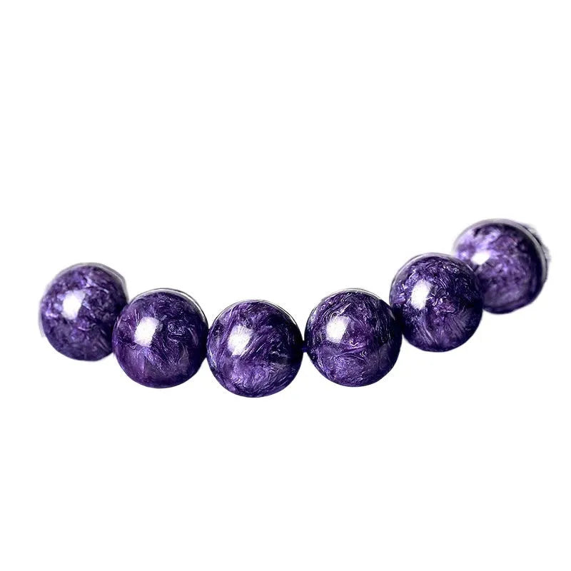 Natural transparent charoite crystal bracelet with platinum setting, showing bead size options.