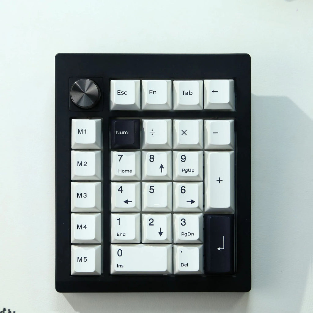 Wireless mechanical numeric keyboard in black and white colour options showing Bluetooth connectivity