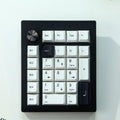 Wireless mechanical numeric keyboard in black and white colour options showing Bluetooth connectivity