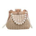 Women's woven straw shoulder bag with pearl chain detail in beige colour, showing interior organiser pockets.
