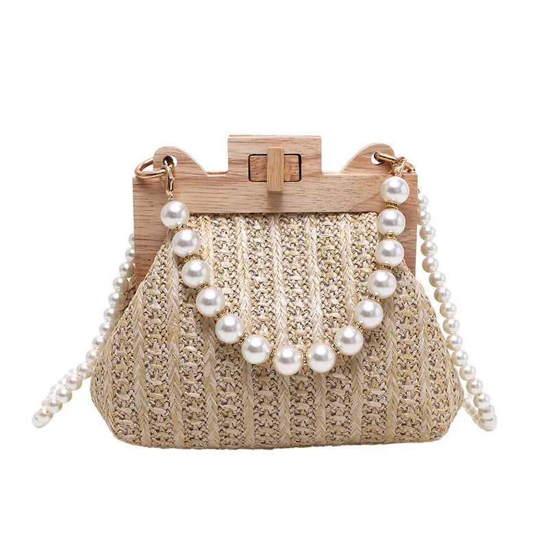 Women's woven straw shoulder bag with pearl chain detail in beige colour, showing interior organiser pockets.