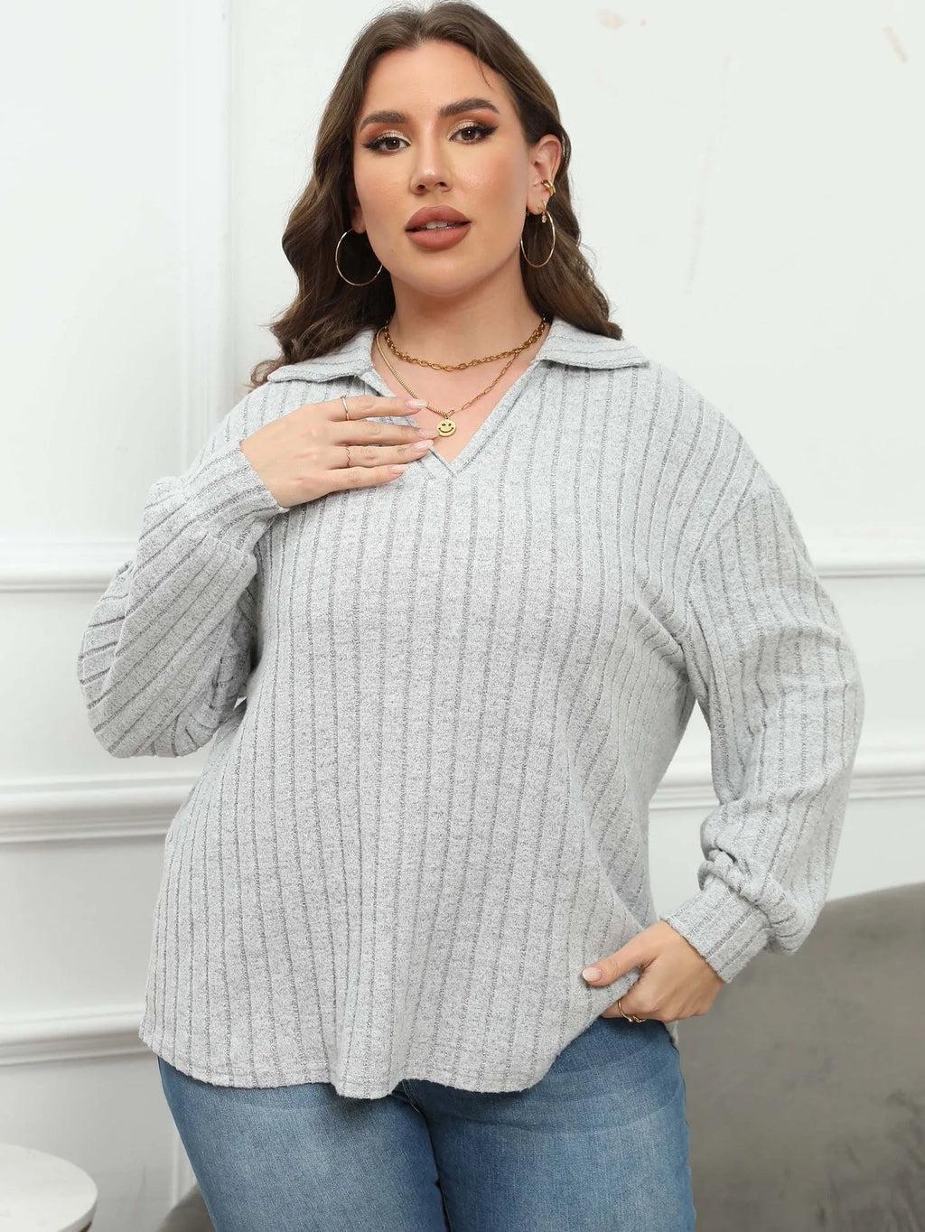 Women's plus size grey polo collar blouse with lantern sleeves, made from polar fleece fabric.