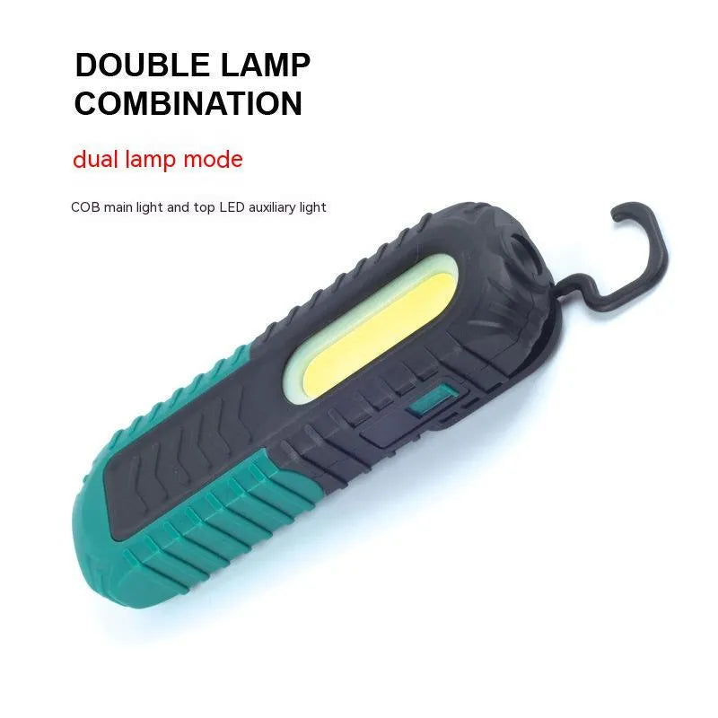 Black and green USB-charged automotive inspection work light with compact design