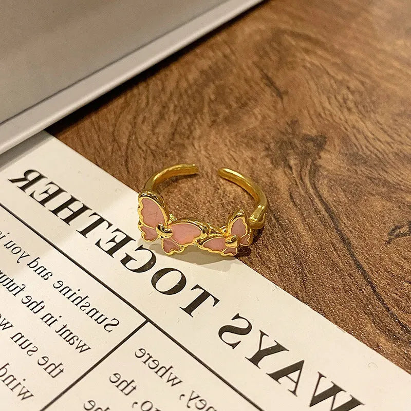 Women's copper butterfly ring with dripping oil finish and adjustable open loop design