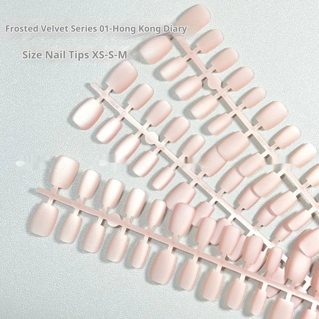 Frosted velvet cat's eye false nails with aurora electroplated finish showing short ladder sizing