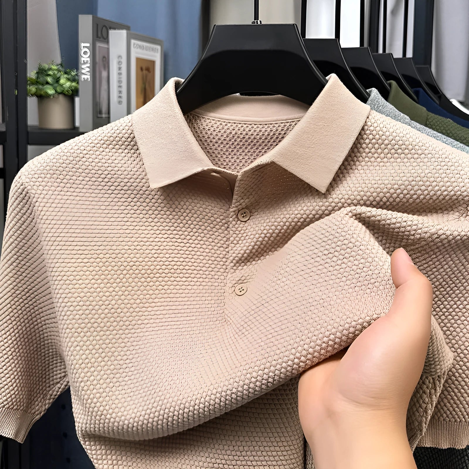 Loose fit pure cotton short sleeve pullover sweater in grey on a hanger.