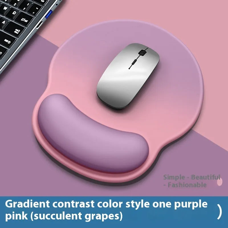 Silicone mouse mat with attached gel wrist support in a gradient blue colour on a desk.