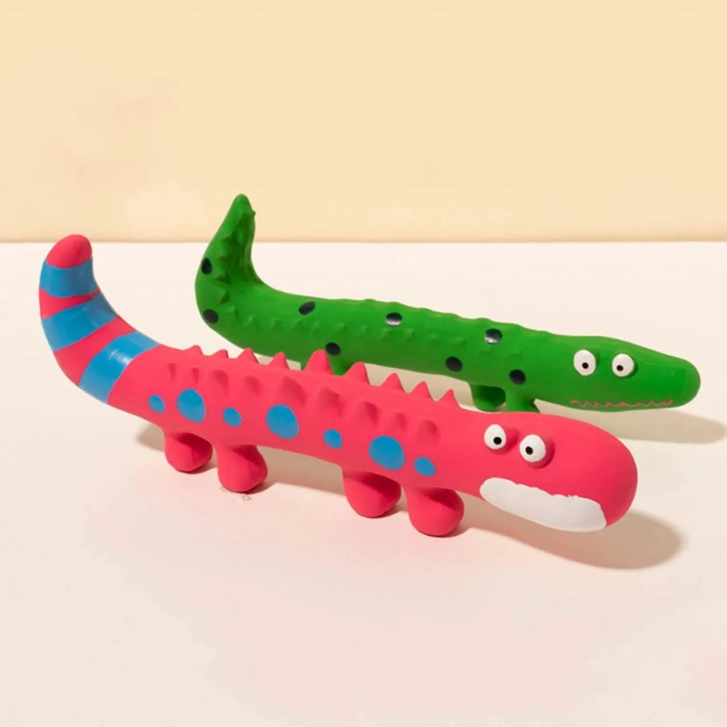 Green lizard-shaped squeaky dog chew toy for aggressive chewers.