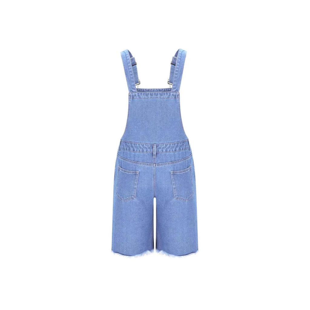 Men's ripped blue denim shorts with attached suspenders on a mid-waist, straight-leg cut.