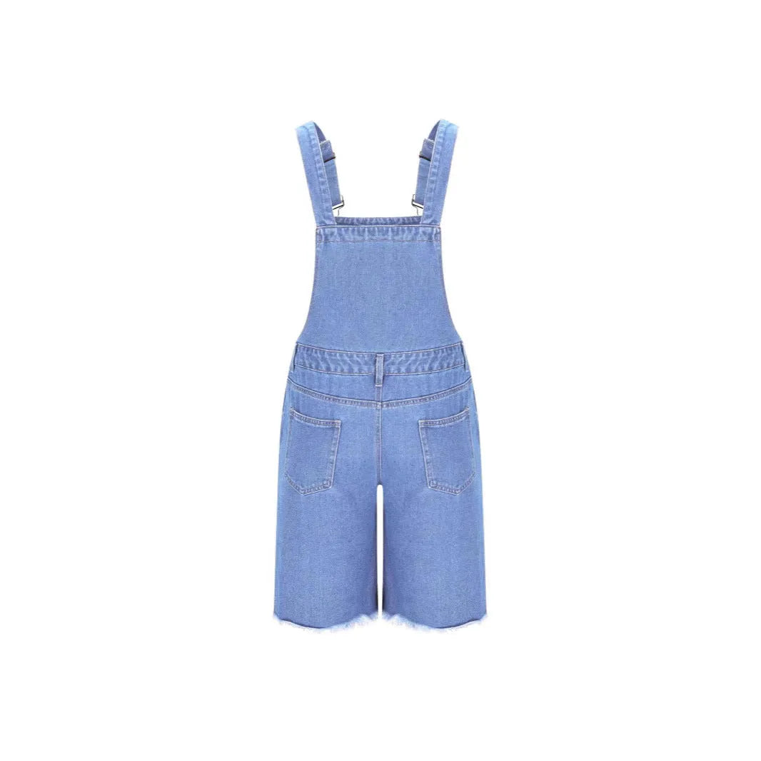 Men's ripped blue denim shorts with attached suspenders on a mid-waist, straight-leg cut.
