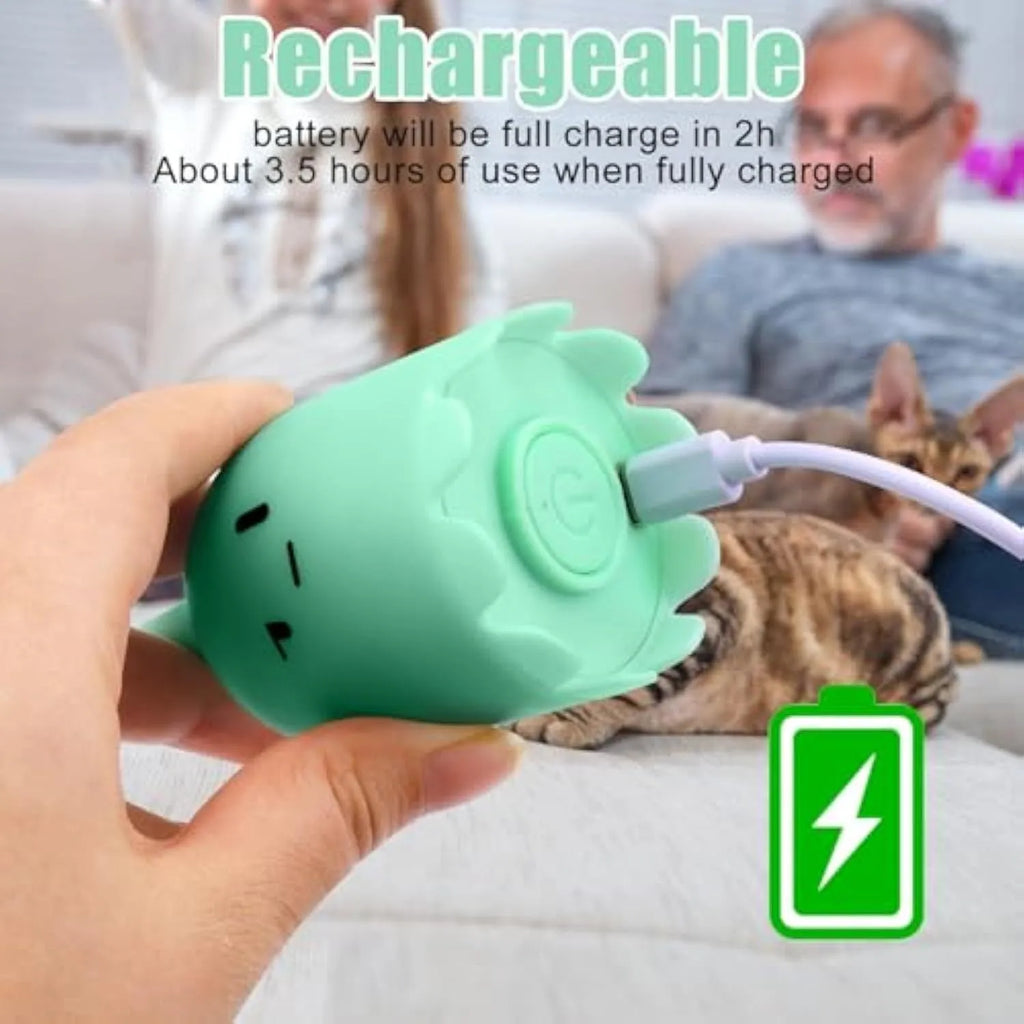Green electronic cat toy with swinging silicone tail on floor for indoor cat play