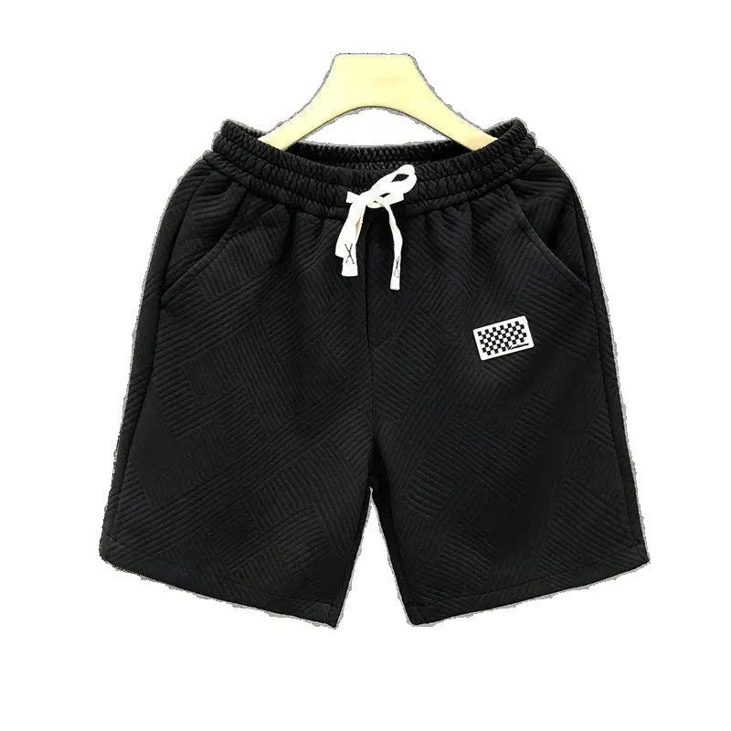 Casual solid colour sports shorts made from elastic polyester fabric.