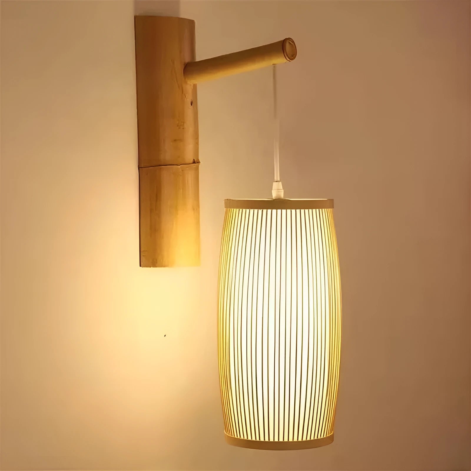 Small woven bamboo table lamp with a natural finish, shown on a wooden surface.