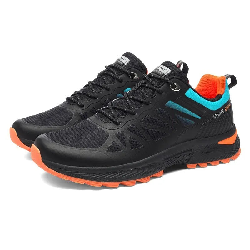 Men's black and orange mesh running shoe with lace-up front and rubber sole.