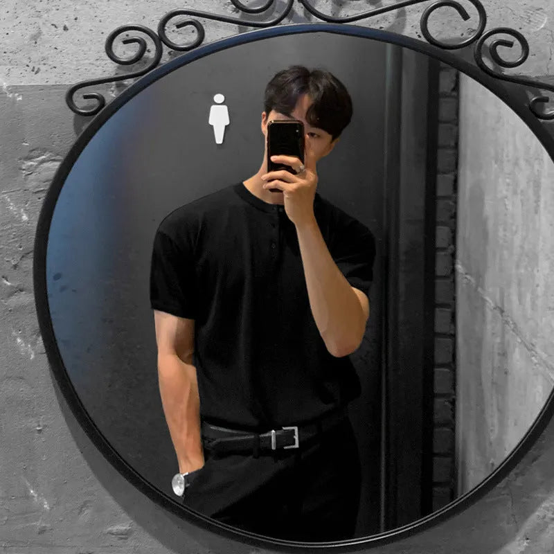 Men's black thin slim-fit short-sleeved knitted pullover shirt on a hanger.