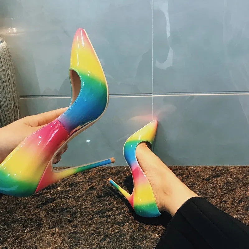 Rainbow coloured women's patent leather sandals with a pointed toe and an ultra-high thin heel.