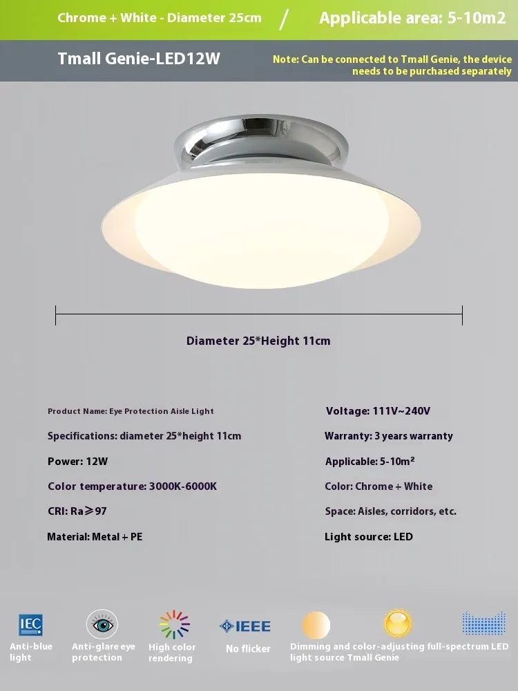 Modern minimalist flying saucer design ceiling lamp in cream yellow on a white ceiling.