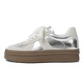 Women's retro casual board shoes with round toe, cross strap, and lace-up front in matte finish.