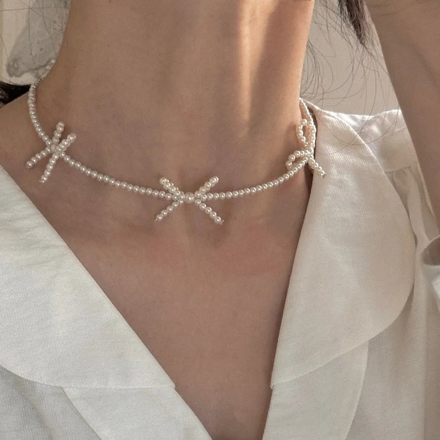 Sweet bow pearl necklace with geometric charm on adjustable 31-40cm chain