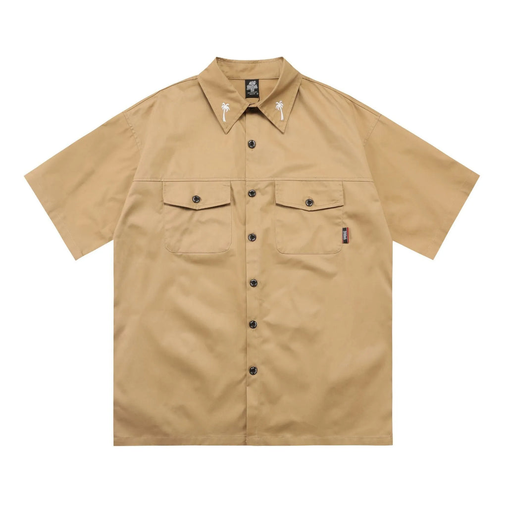 Men's black cotton blend half-sleeve shirt with a chest pocket and loose fit.