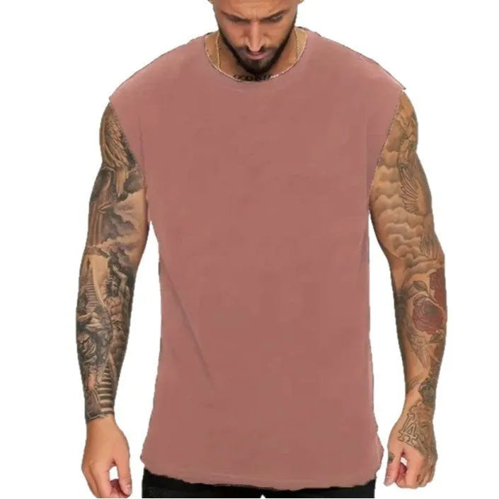 Men's solid colour loose fit cotton tank top on a hanger, showing straight hem and sleeveless design.