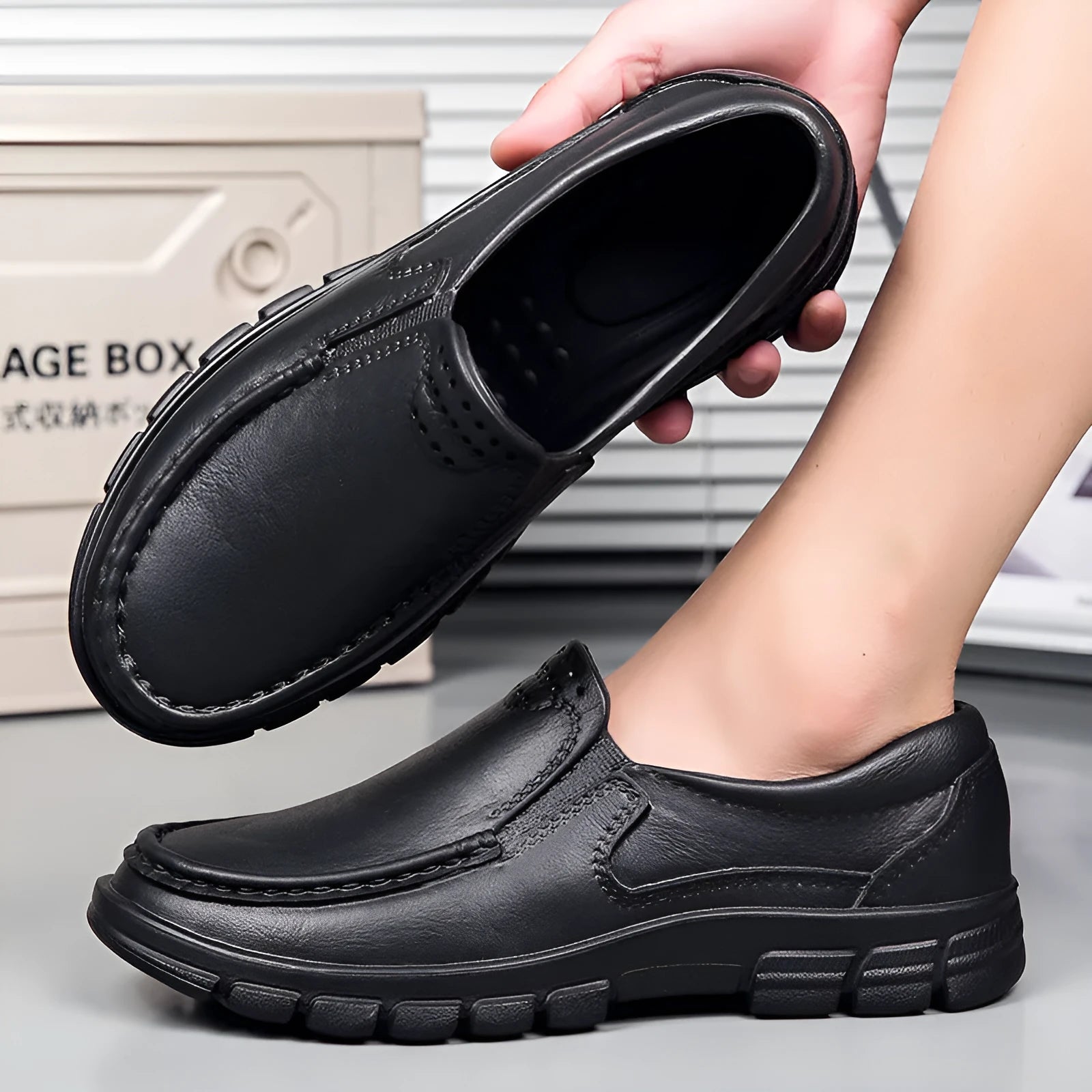 Men's black slip-on platform shoes with round toe and mid-top design on a white background.