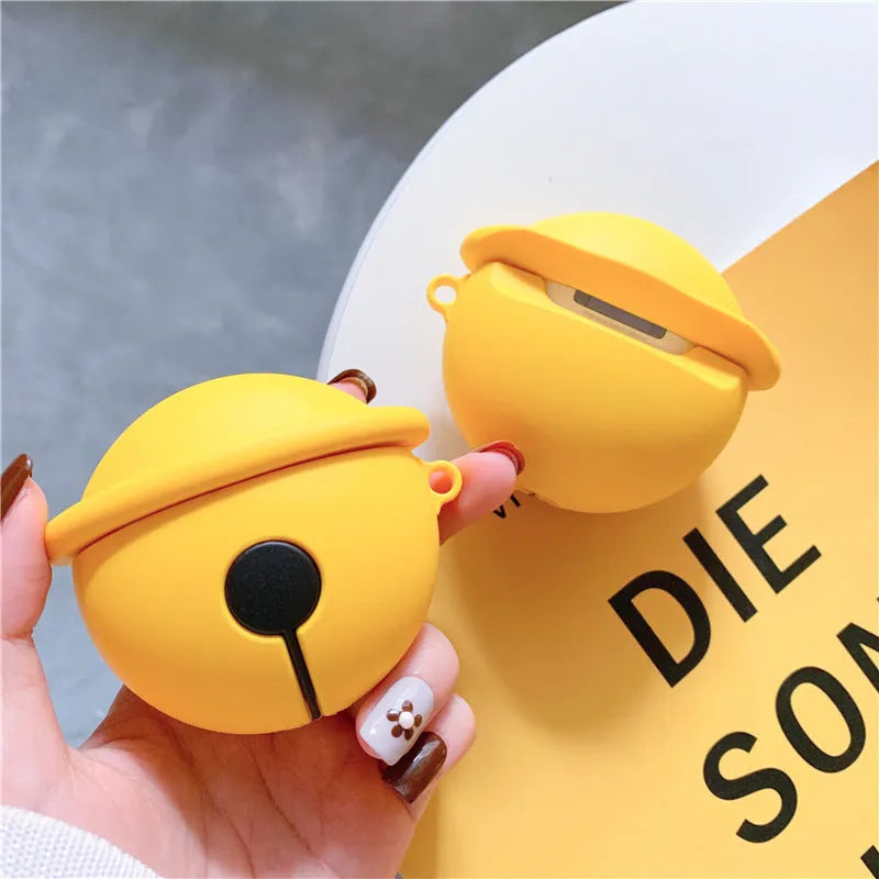 Yellow silicone AirPods case with small bell accessory attached for AirPods 1 and 2