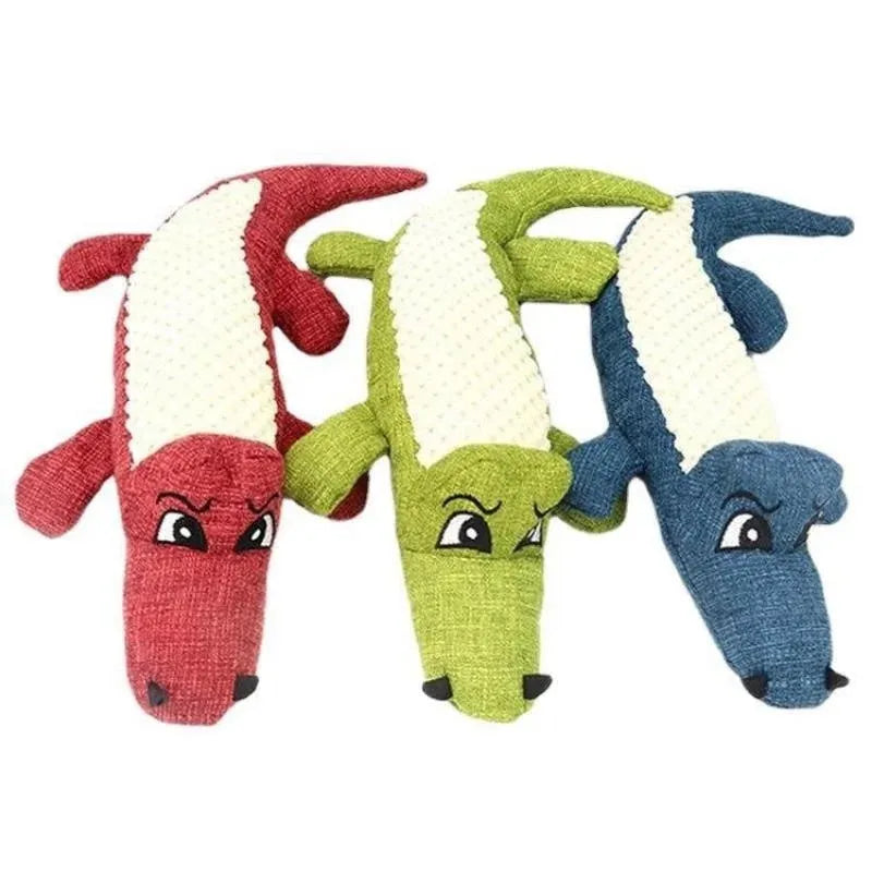 Blue, green, and red corn cob shaped plush dog toy with a textured surface on a white background.