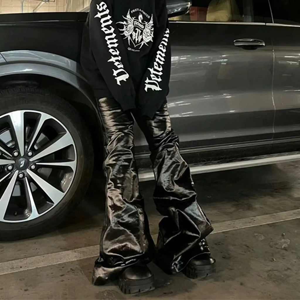 Black shiny patent leather coated skinny jeans with straight-leg design on cotton denim