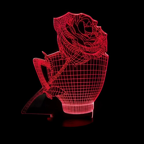 3D rose-shaped LED night light with remote control on a table, displaying a purple glow.