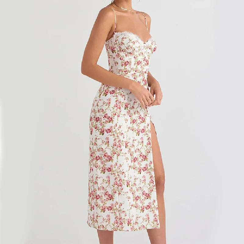 Blue lace flowers print long dress with spaghetti straps and a high leg slit on a mannequin.