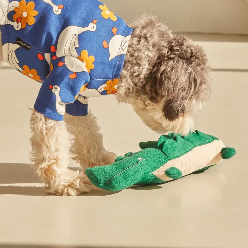 Green plush toy dog measuring 35cm long by 18cm wide
