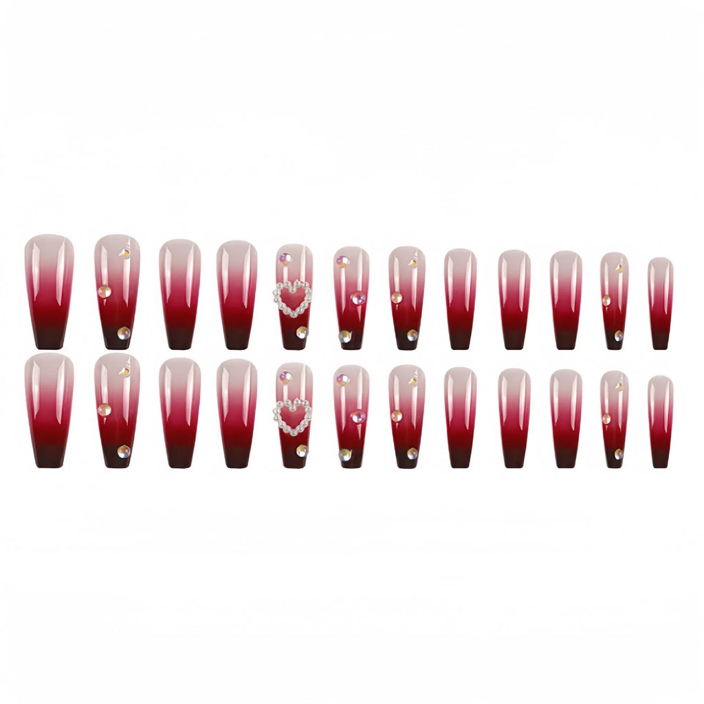 Wine red gradient fake nail tips with pearl heart design in a long ballet style.