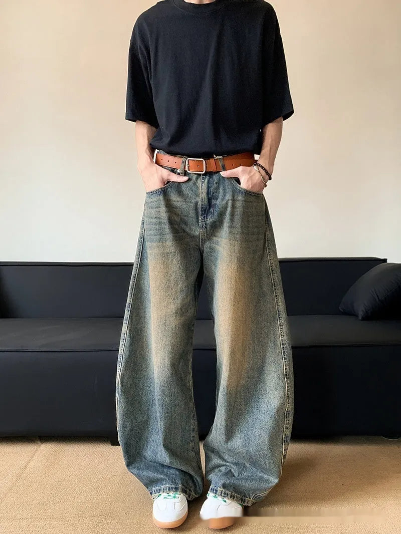 Men's retro blue distressed slim-fit wide-leg jeans on a model