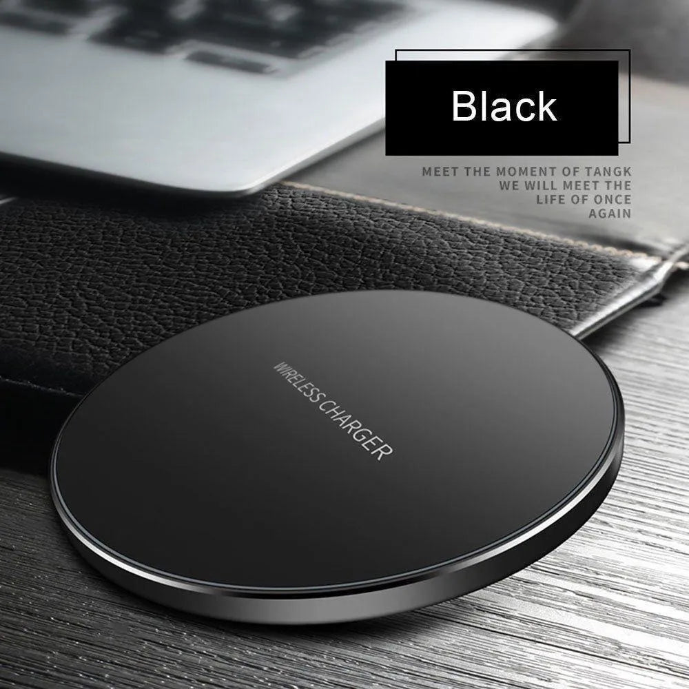 Black ultra-thin square wireless fast charging pad with USB cable on a desk