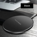 Black ultra-thin square wireless fast charging pad with USB cable on a desk
