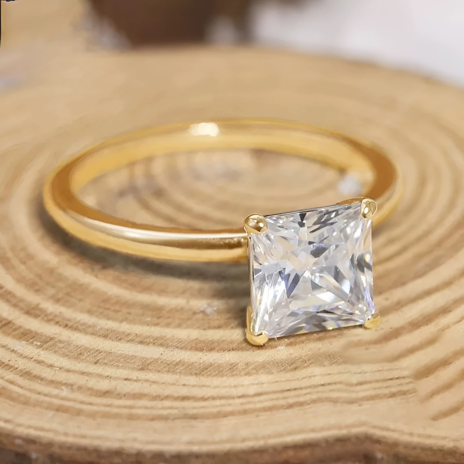 A geometric 925 silver ring with a round zirconium detail, shown in silver, gold, and rose gold finishes.