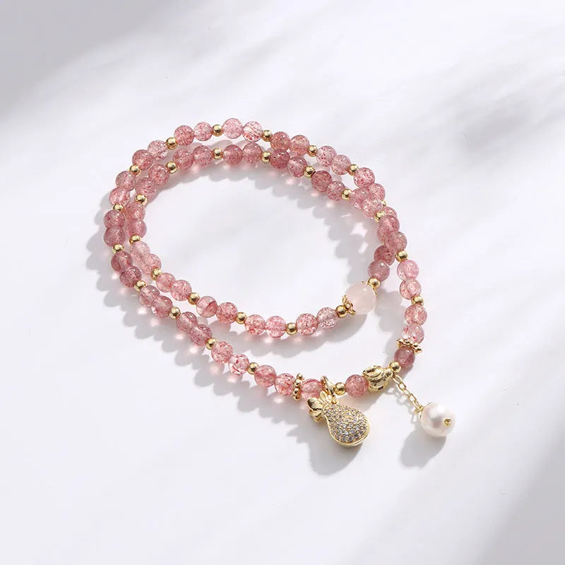 Women's strawberry quartz crystal bracelet with geometric design for money drawing and luck changing