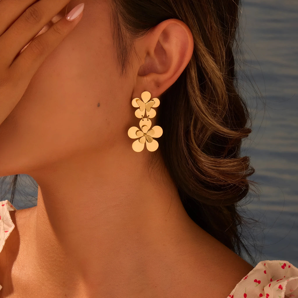 Gold-coloured butterfly earrings with flower and geometric designs for women