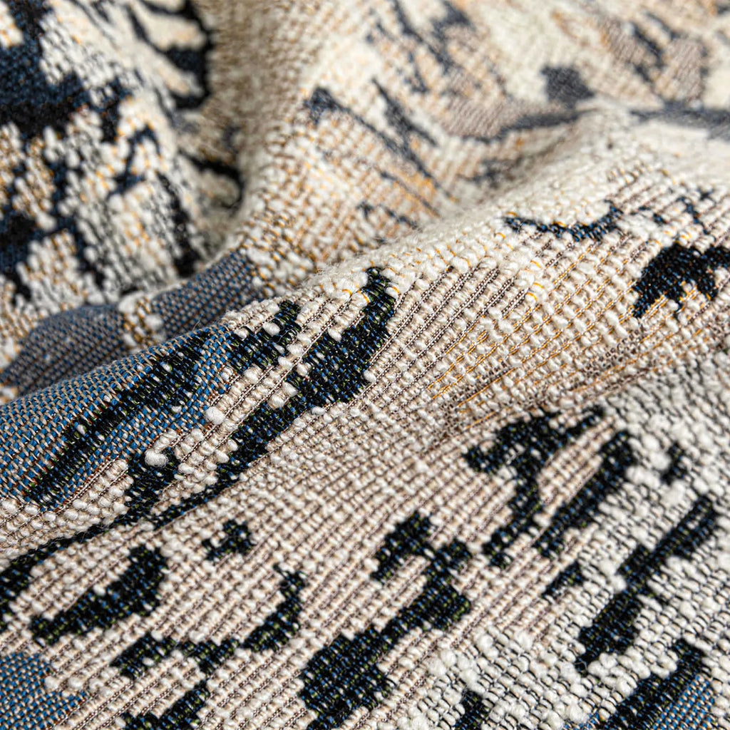 Antique blue floral patterned cushion in wool blend material showing French style design with feather velvet filler