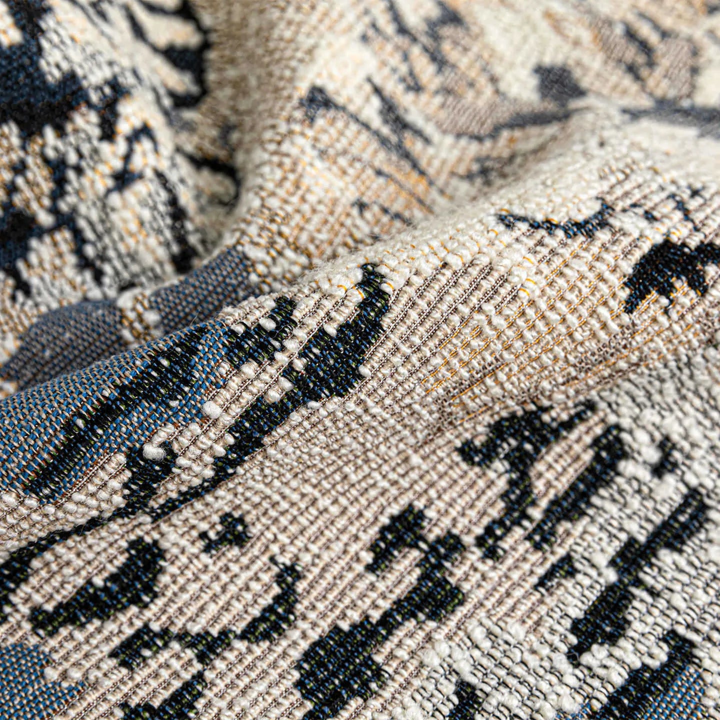 Antique blue floral patterned cushion in wool blend material showing French style design with feather velvet filler