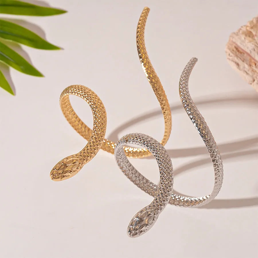 Gold twisted snake design ring and bracelet jewellery set with exaggerated winding metal construction