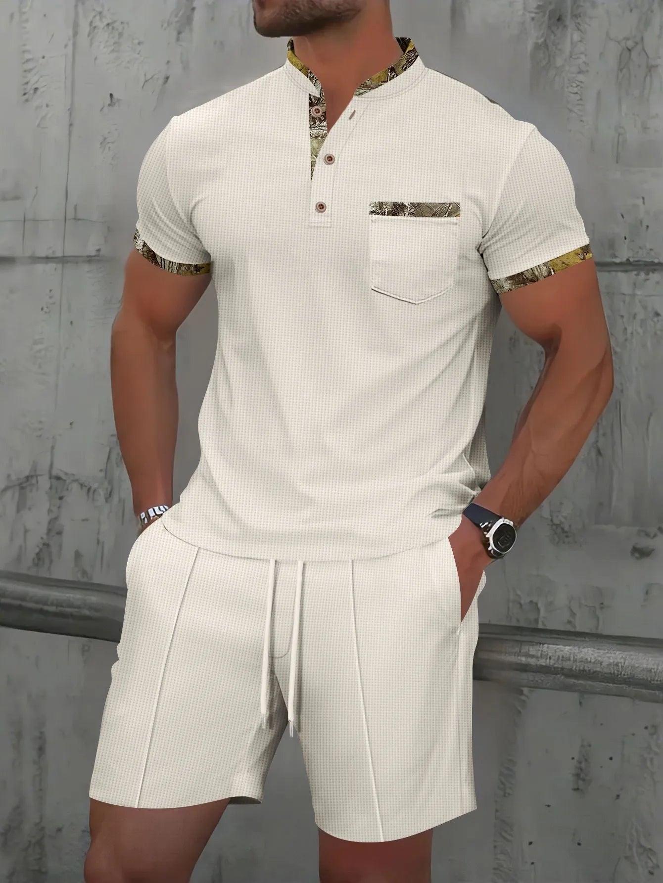 Man wearing a grey waffle knit zip-up polo collar tracksuit with matching shorts for summer leisure.
