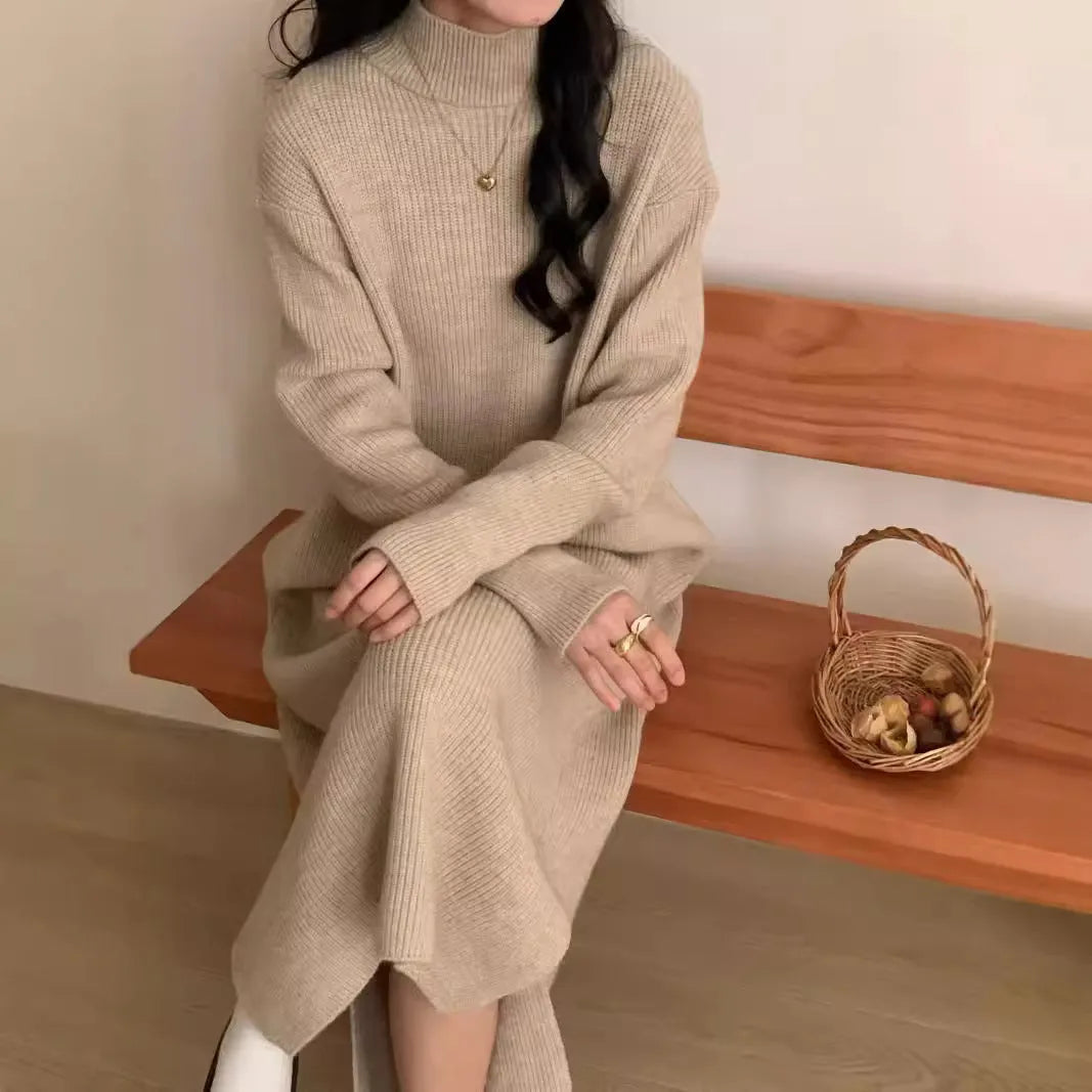 Woman wearing a beige half-turtleneck, high-waisted, knee-length acrylic knit dress.