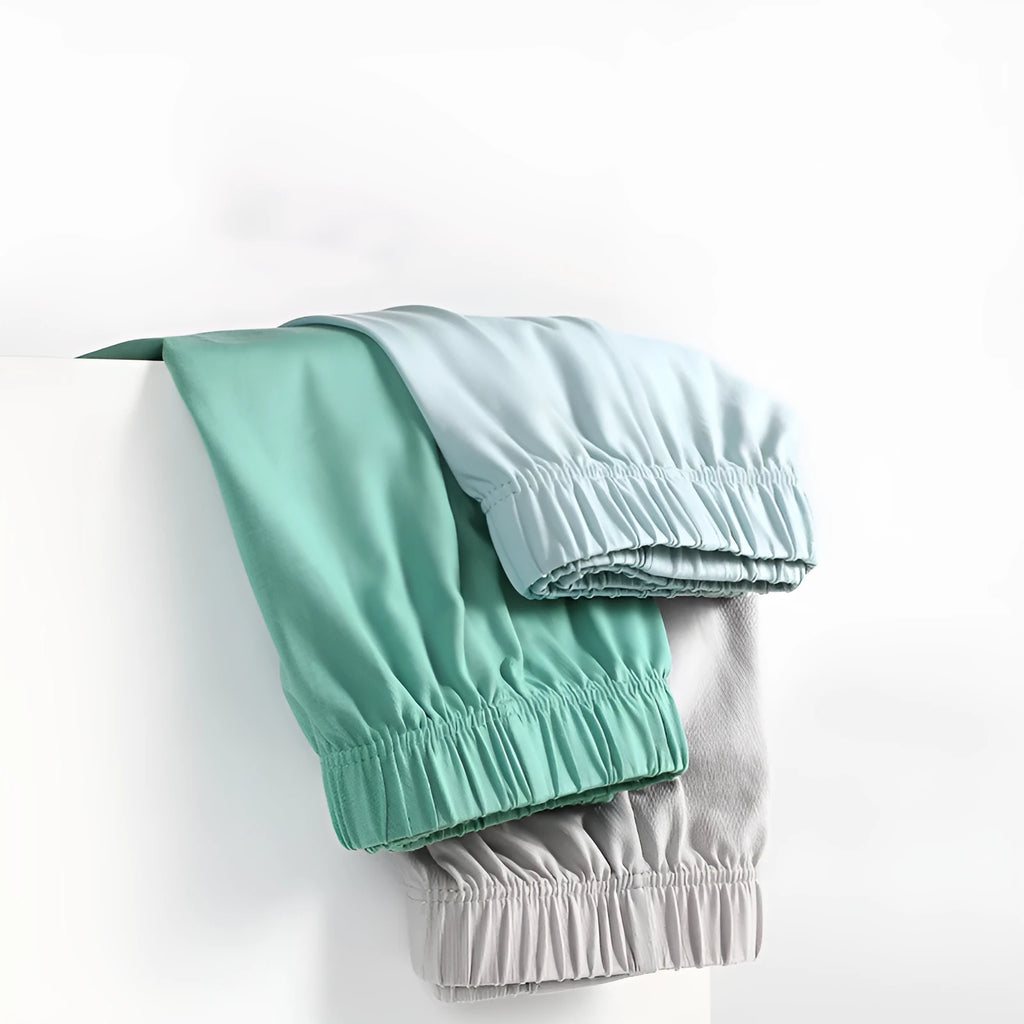 Men's loose-fitting cotton boxer shorts in a solid colour, shown in a light grey shade on a mid waist.