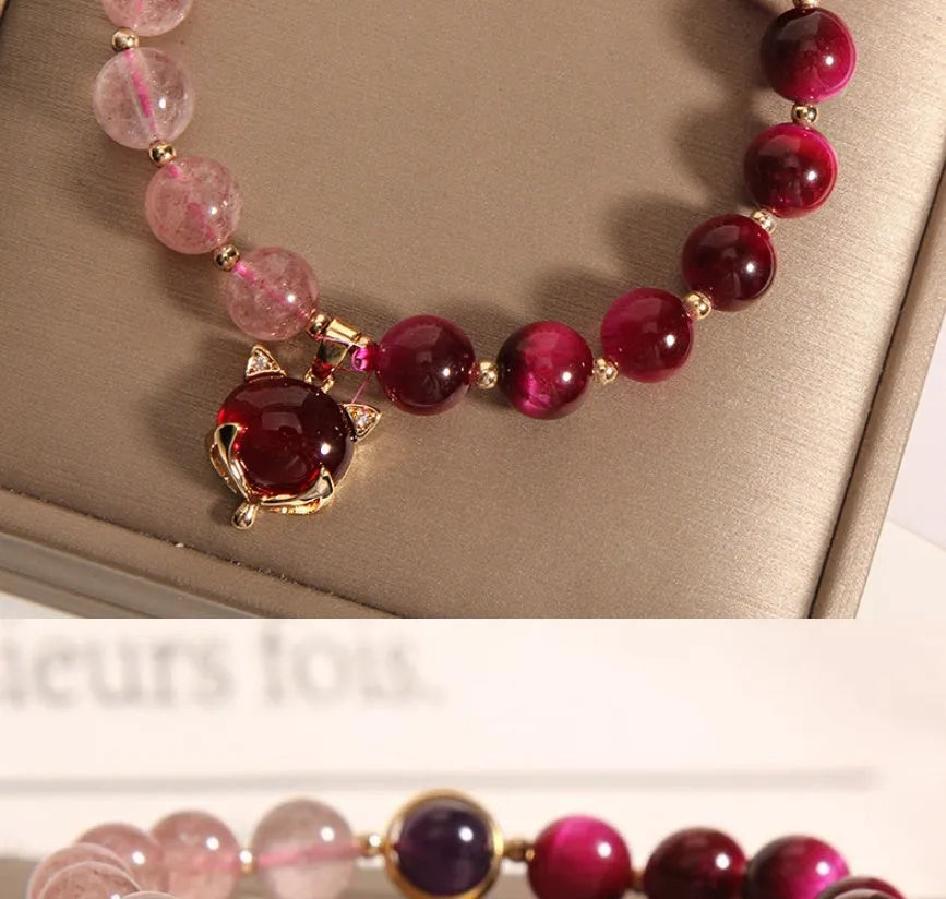 Women's simple bracelet with strawberry crystal beads on elastic rope, showing picture-accurate colour