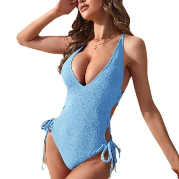 Women's hollow backless one-piece tether bikini swimsuit in polyester.